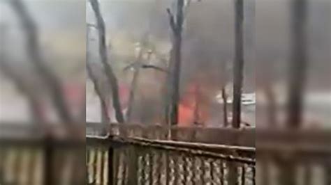 Crews battle large brush fire in Natick